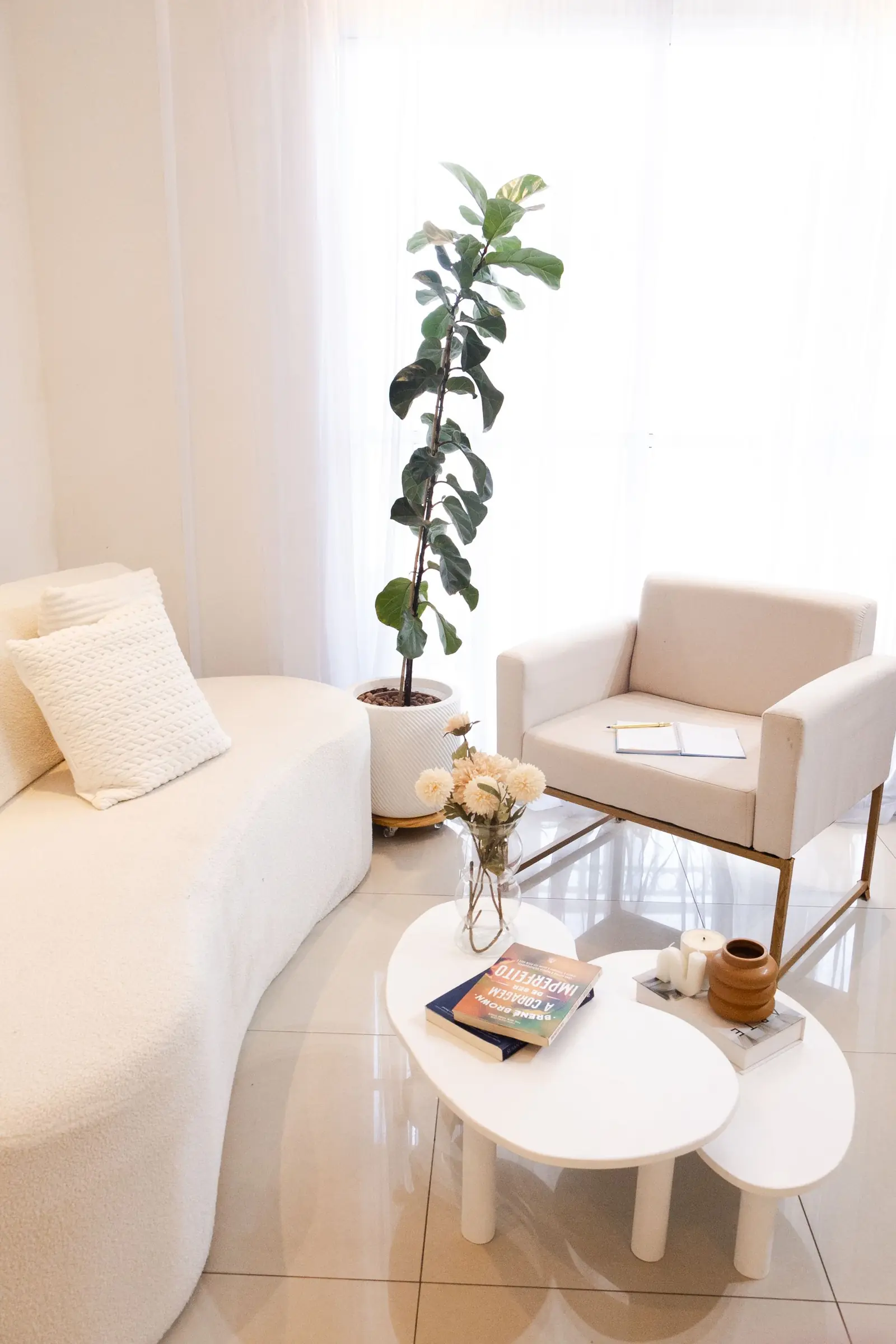 Bright, tidy living room with a white sofa